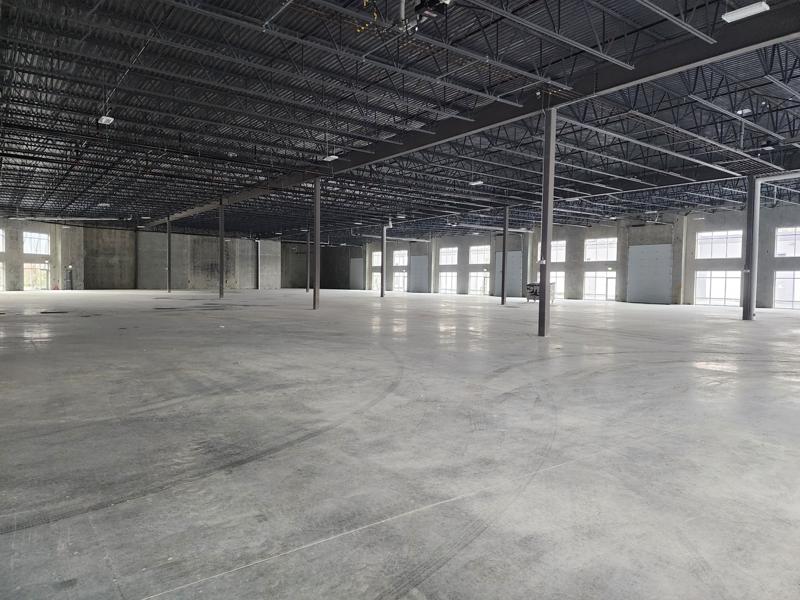 Open interior of a new flex warehouse unit with 24 foot clear height and steel trusses in Chilliwack